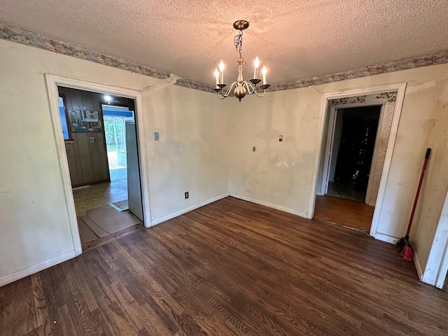 1640 Dogwood Rd, Charleston, SC 29414 - unfurnished dining area featuring a textured ceiling, wood finished floors, a chandelier, and baseboards