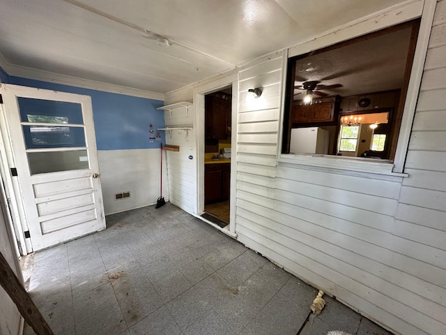 1640 Dogwood Rd, Charleston, SC 29414 - unfurnished room featuring wooden walls, tile patterned floors, and ceiling fan