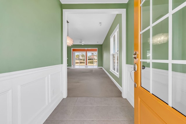 hallway with light colored carpet