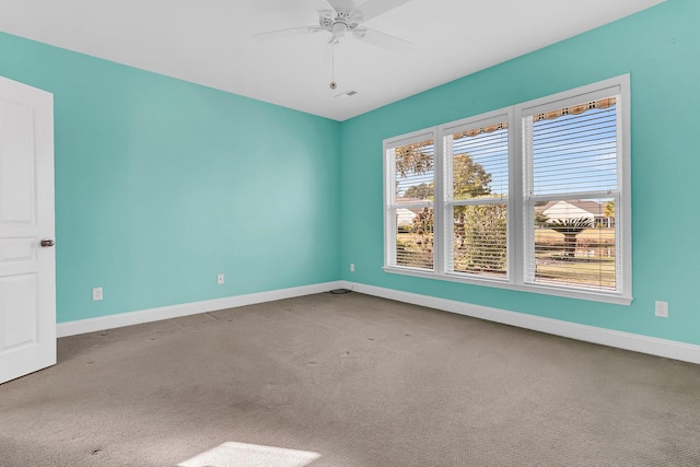 carpeted empty room with ceiling fan