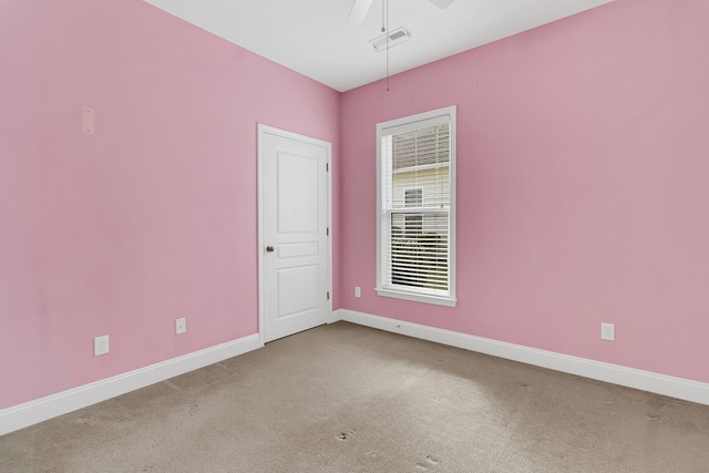 carpeted empty room with ceiling fan