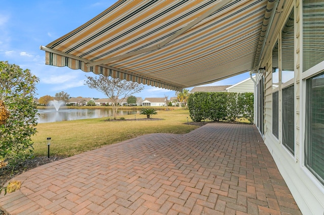 view of patio featuring a water view