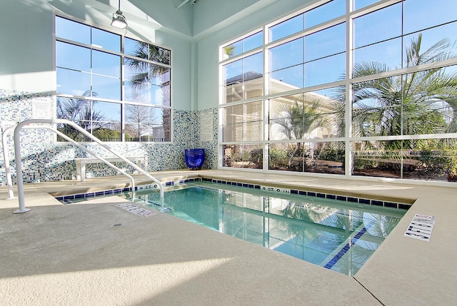 view of swimming pool with ceiling fan