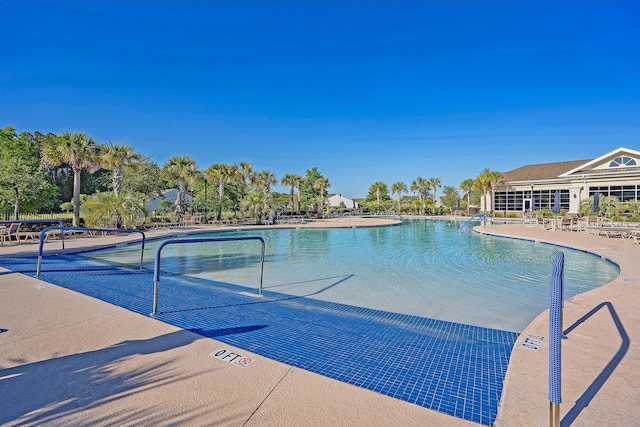 view of swimming pool with a patio