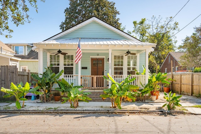 bungalow-style home featuring ceiling fan and a porch