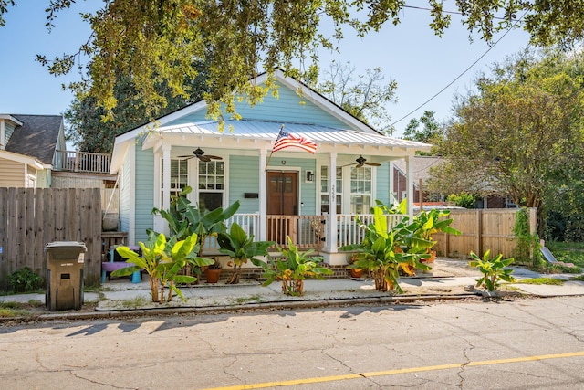 bungalow-style house with ceiling fan and covered porch