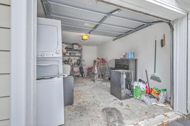 garage with stacked washing maching and dryer