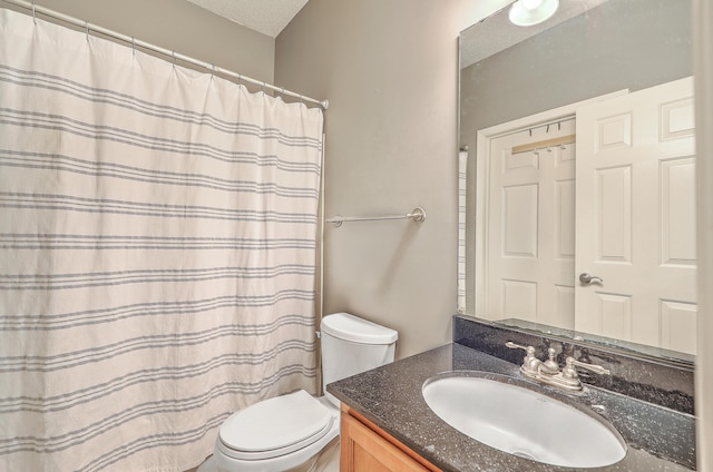 bathroom with vanity, a textured ceiling, toilet, and a shower with shower curtain