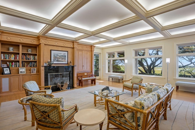 sunroom featuring a fireplace, beamed ceiling, and coffered ceiling