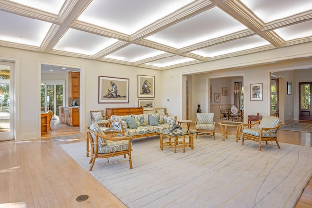 living room featuring light hardwood / wood-style flooring, beamed ceiling, and coffered ceiling