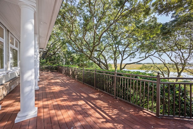 wooden terrace with a water view