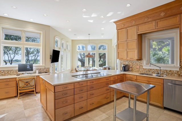 kitchen featuring kitchen peninsula, backsplash, black electric cooktop, dishwasher, and hanging light fixtures