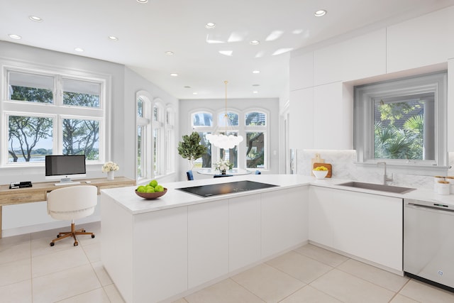 kitchen with pendant lighting, dishwasher, sink, black electric cooktop, and plenty of natural light