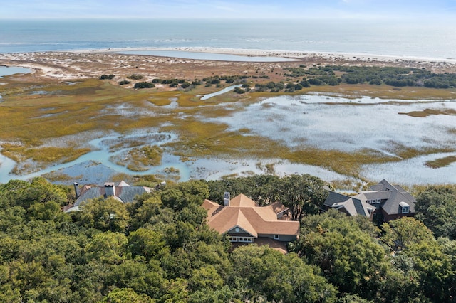 birds eye view of property featuring a water view and a view of the beach