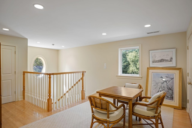 dining room featuring light hardwood / wood-style flooring and plenty of natural light