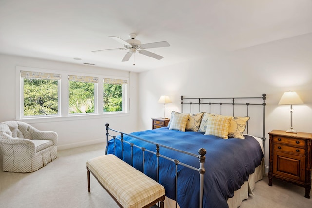 bedroom with ceiling fan and light colored carpet