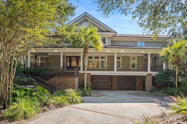 view of front facade featuring a porch and a garage