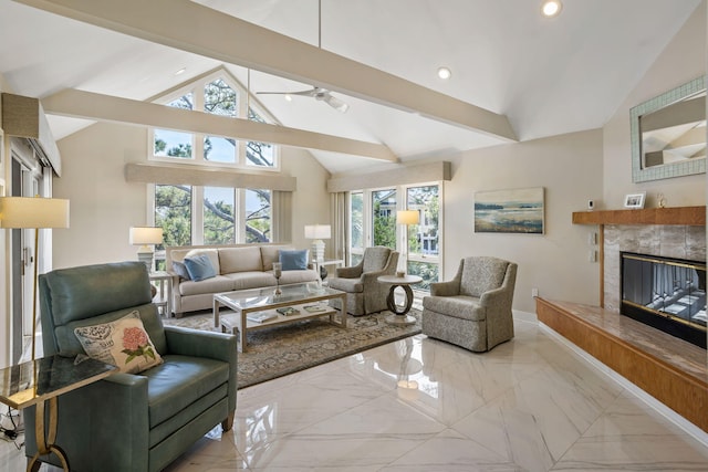 living room with beam ceiling, a healthy amount of sunlight, a tiled fireplace, and high vaulted ceiling