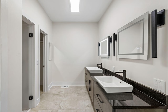 bathroom with vanity and tile patterned floors