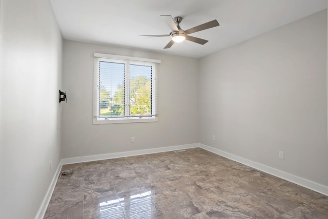 spare room with ceiling fan