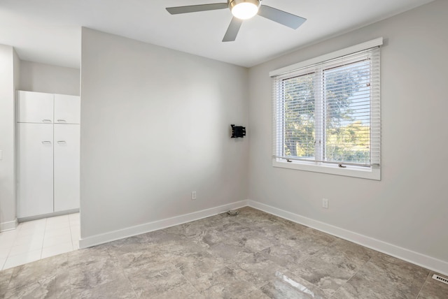 unfurnished room featuring ceiling fan