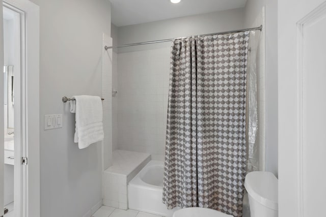 full bathroom with vanity, toilet, tile patterned floors, and shower / bath combo with shower curtain