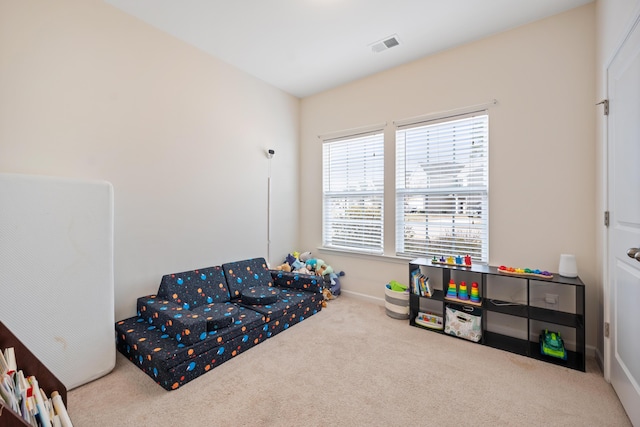 sitting room featuring carpet flooring