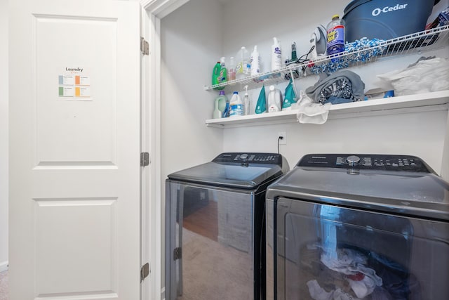 washroom with washing machine and clothes dryer