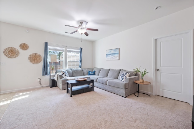 carpeted living room featuring ceiling fan