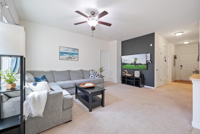 living room with ceiling fan and light carpet