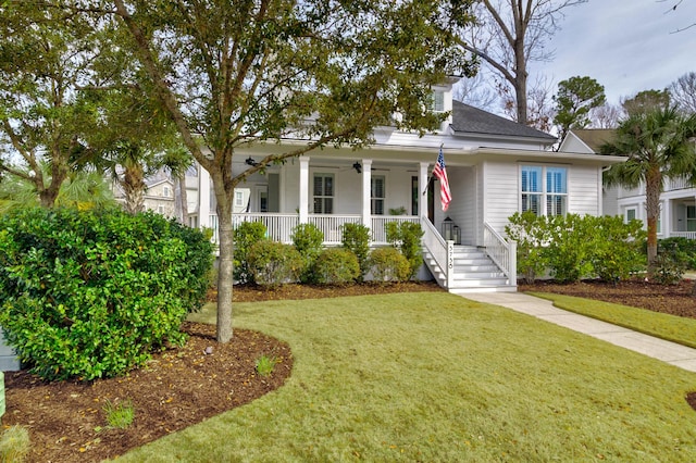 view of front of property with a front yard and covered porch