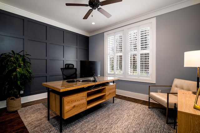 office space featuring baseboards, ceiling fan, ornamental molding, and a decorative wall