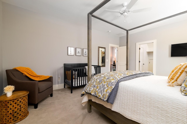 bedroom with ceiling fan and light colored carpet