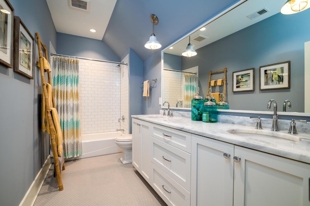 bathroom with shower / tub combo, visible vents, and a sink