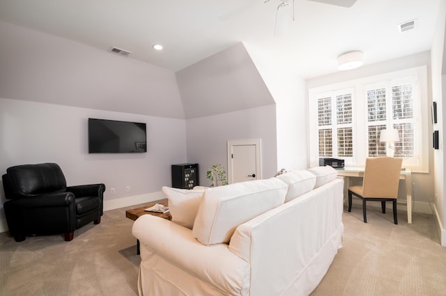 living room featuring visible vents, light carpet, and baseboards