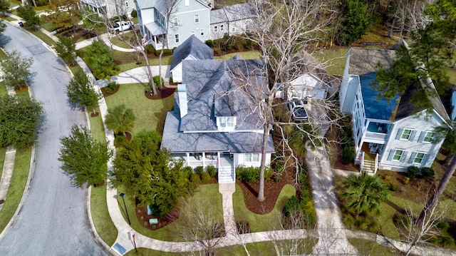 birds eye view of property with a residential view