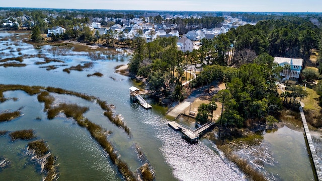 drone / aerial view with a residential view and a water view