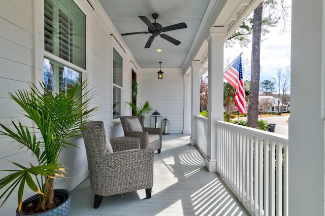 balcony featuring a ceiling fan and covered porch