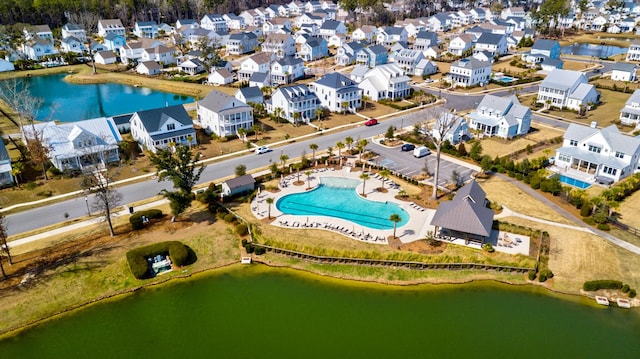 aerial view with a residential view and a water view