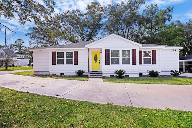 ranch-style house with a front lawn