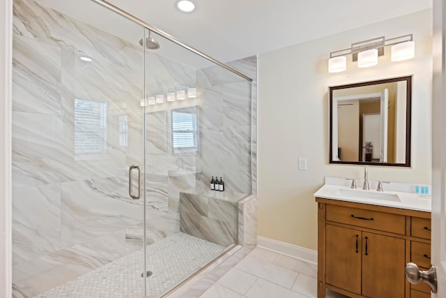 bathroom featuring vanity and an enclosed shower