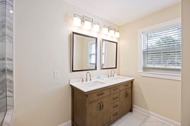 bathroom with tile patterned flooring and vanity