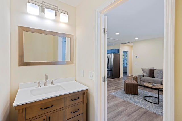 bathroom featuring hardwood / wood-style flooring and vanity