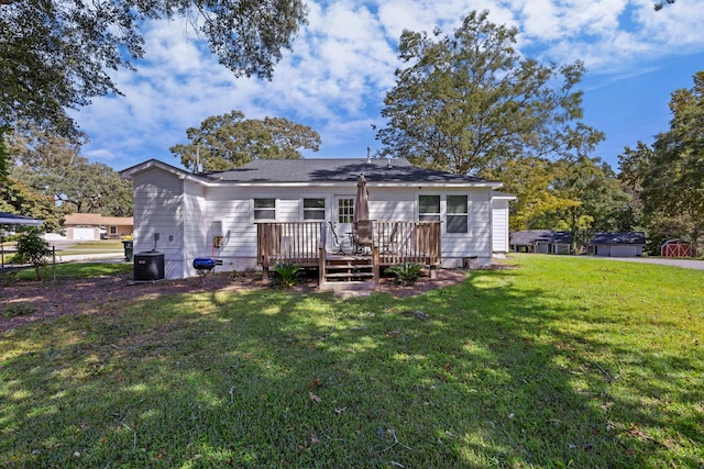 view of front of house featuring a front yard and a deck