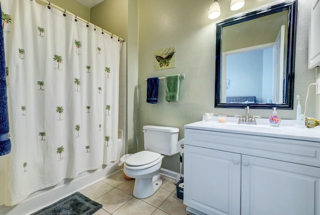 bathroom with tile patterned floors, shower / bathtub combination with curtain, toilet, vanity, and baseboards