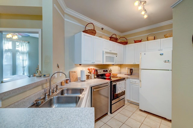 kitchen featuring white cabinets, ornamental molding, stainless steel appliances, and a sink