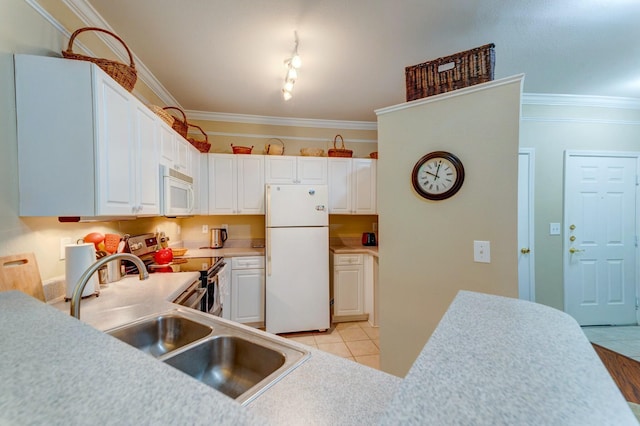 kitchen featuring white cabinets, crown molding, white appliances, and light countertops