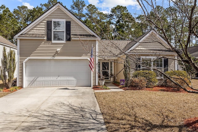 view of front of home with a garage and driveway