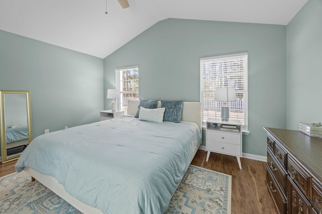 bedroom with lofted ceiling, ceiling fan, baseboards, and wood finished floors