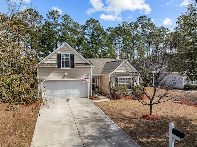 traditional-style house with roof with shingles and driveway